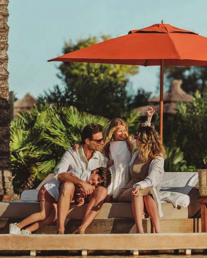 Family relaxing on a garden deck